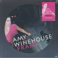 Amy Winehouse 'Frank' vinyl record album cover, showing a circular photo of the artist in a pink top against a dark background, with a bright pink square cover insert in the top right.