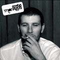 Black and white album cover with a person smoking, featuring the band ' Arctic Monkeys' logo.