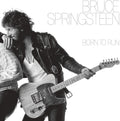Black and white album cover of 'Born to Run' by Bruce Springsteen featuring Bruce holding a guitar.