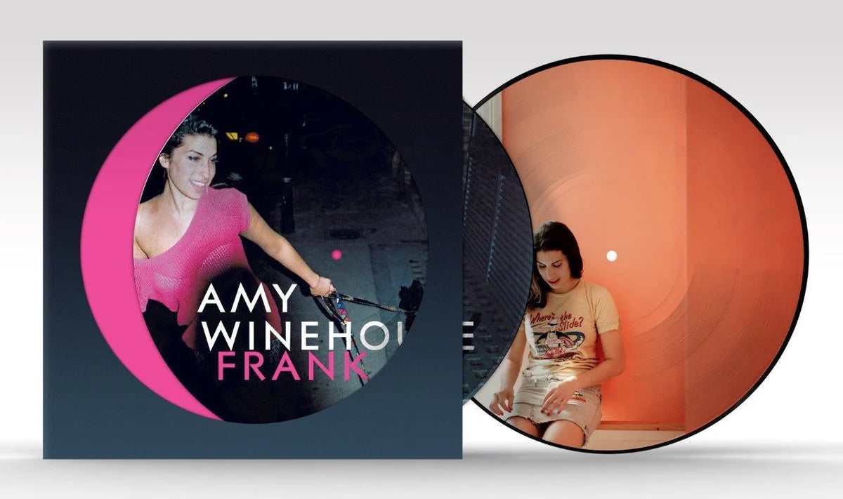 Vinyl record with cover featuring a woman in a pink dress and text 'Amy Winehouse Frank'.