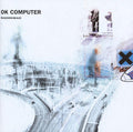 Album cover for 'OK Computer' by Radiohead with abstract design and text.