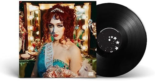 A vinyl record partially pulled from its album cover, showing a Chappell dressed in beauty pageant attire in front of a mirror with light bulbs.