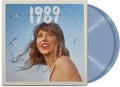 Vinyl record with a cover featuring a person and the text '1989 Taylor's Version' against a blue sky with birds, the crystal blue vinyl is displayed protruding from the sleeve.